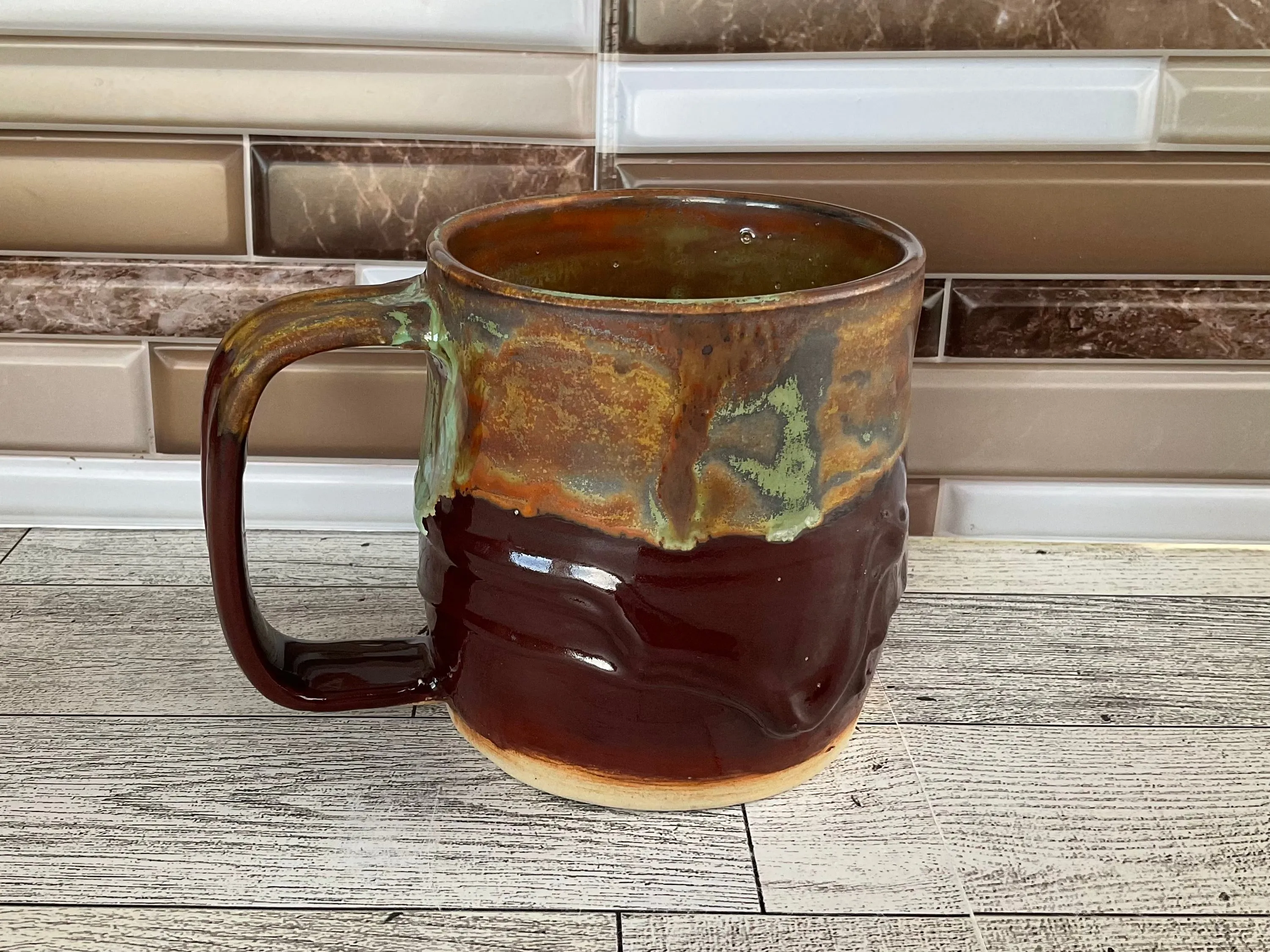 15 oz Green Tea over Cordovan Drippy Ceramic Mug